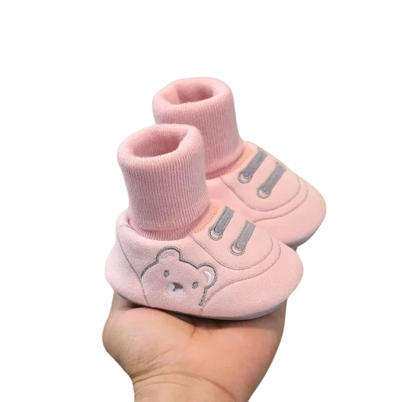 Rosa mjuka babyskor med ribbad mudd och halkdämpande sula
